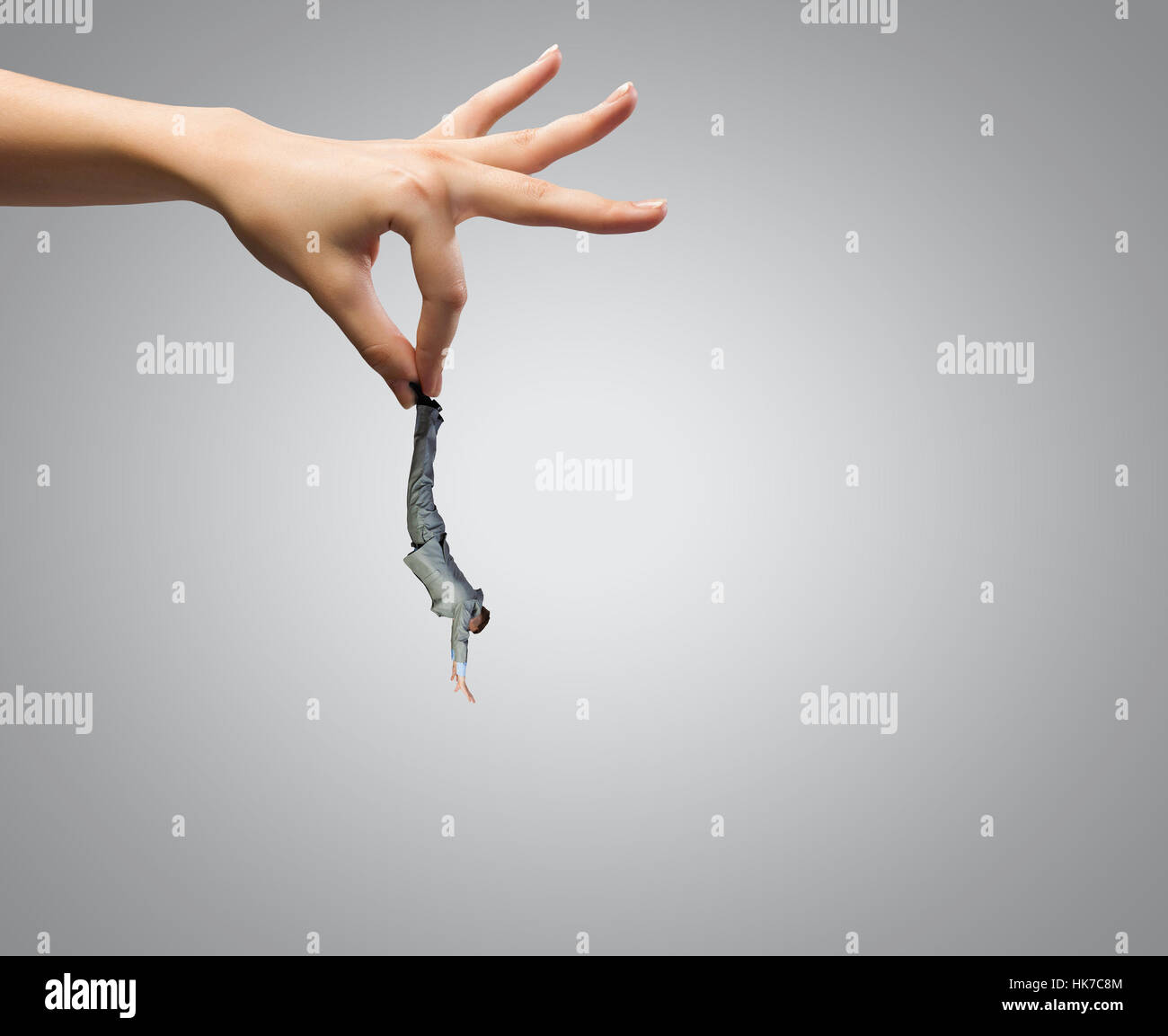 Human Catching Close up of big human hand catching businessman Stock Photo - Alamy