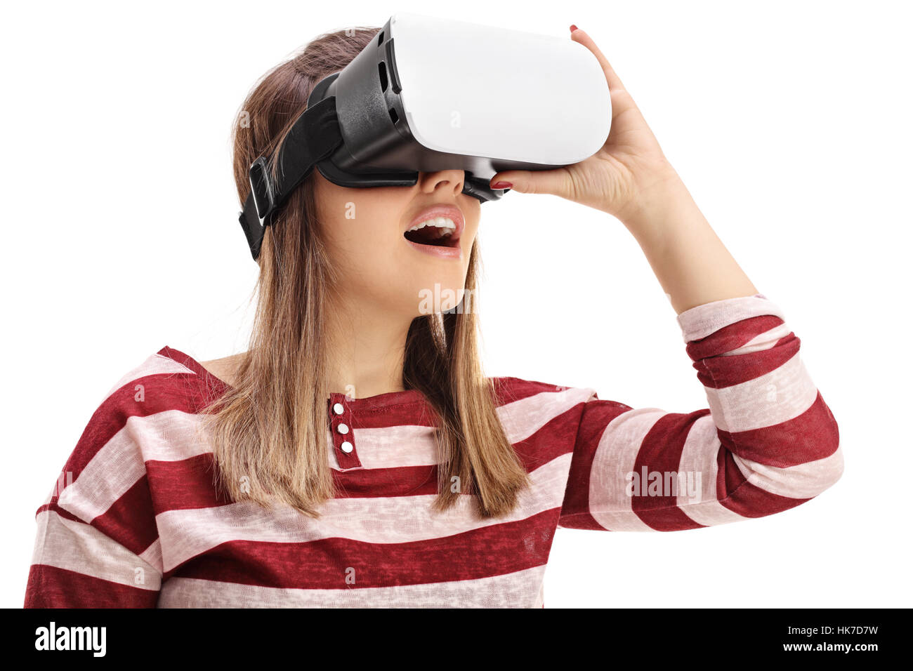 Young woman using a virtual reality headset isolated on white ...