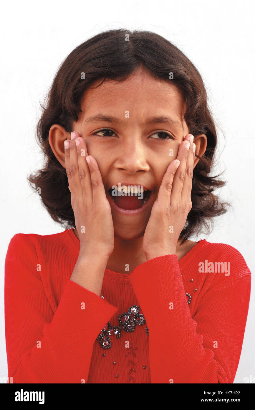 Little girl surprised with hands on her face Stock Photo - Alamy