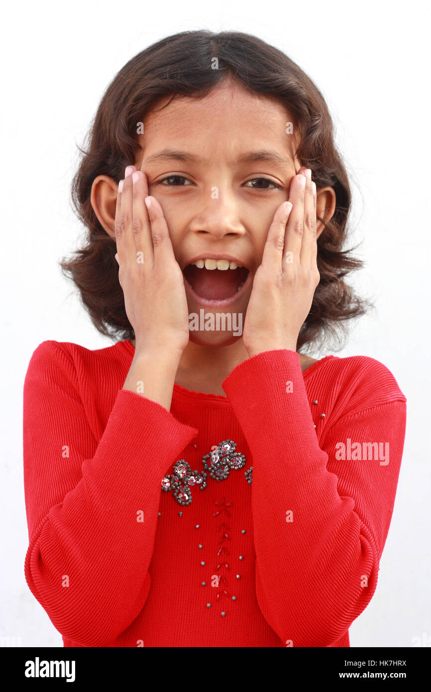 Little girl surprised with hands on her face Stock Photo - Alamy