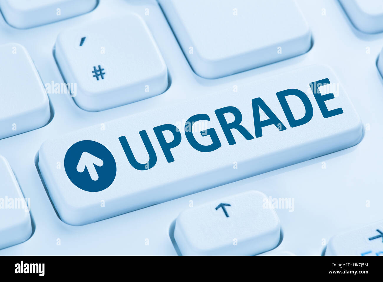 Upgrade upgrading software program symbol blue computer keyboard Stock Photo