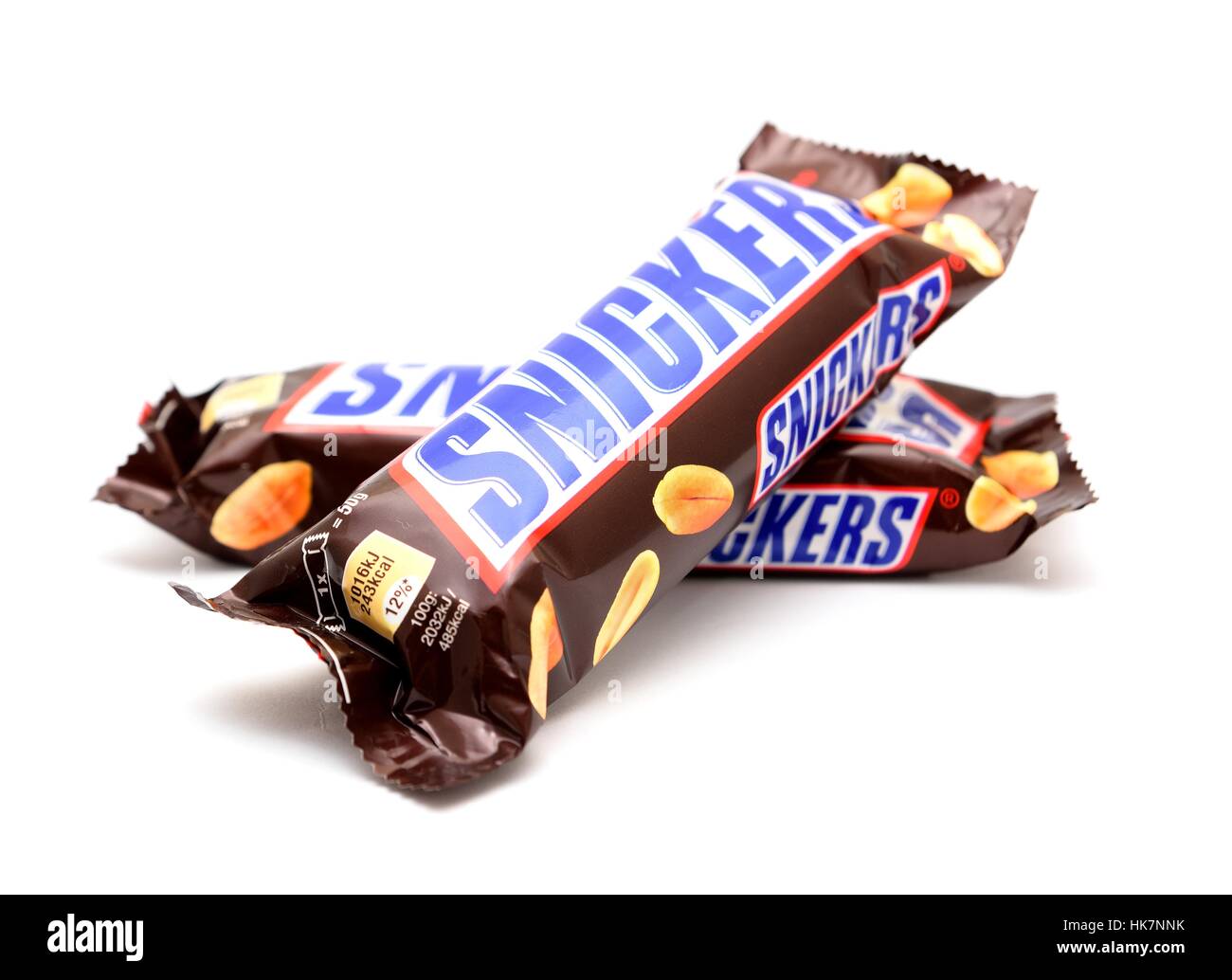 Two wrapped Snickers chocolate bars on white background. Stock Photo