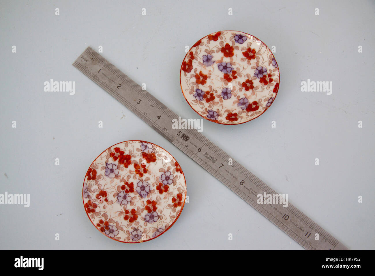 Small decorative saucers with ruler Stock Photo Alamy