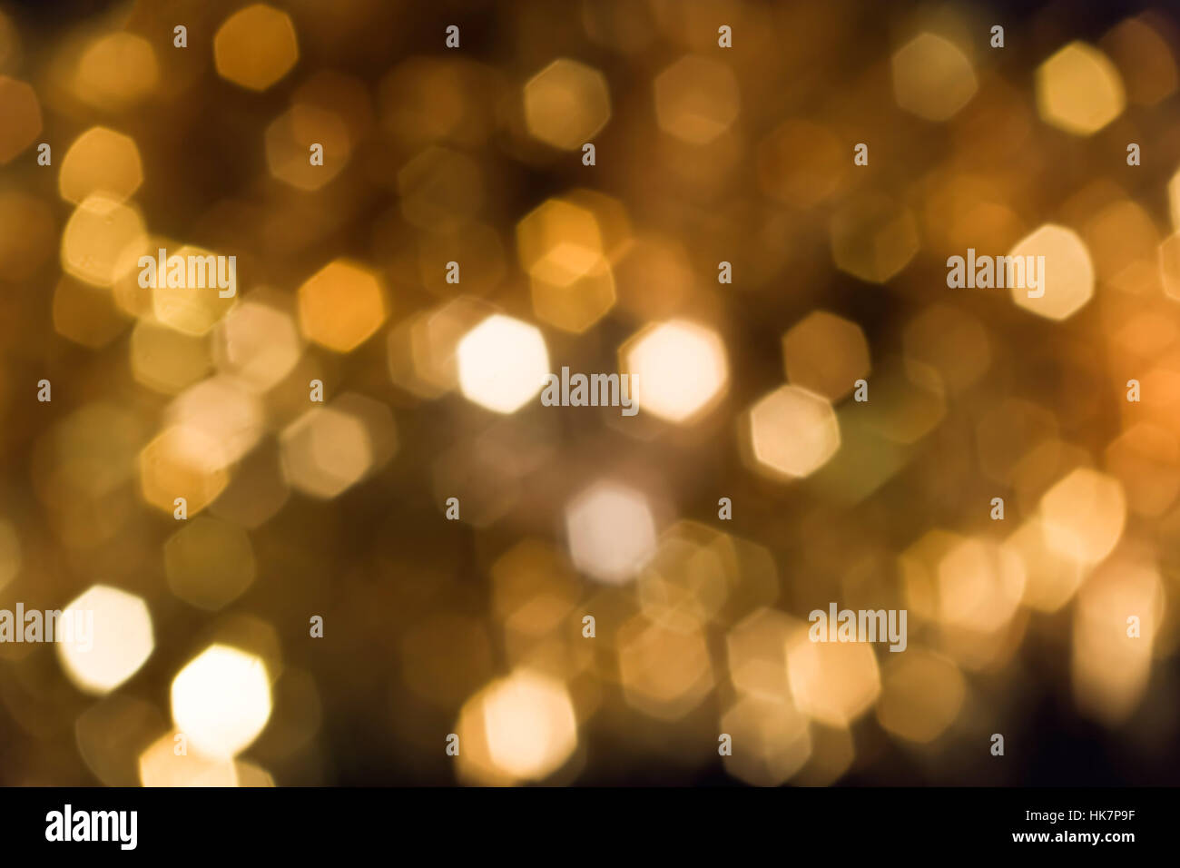 Abstract background of blurry golden lights Stock Photo - Alamy
