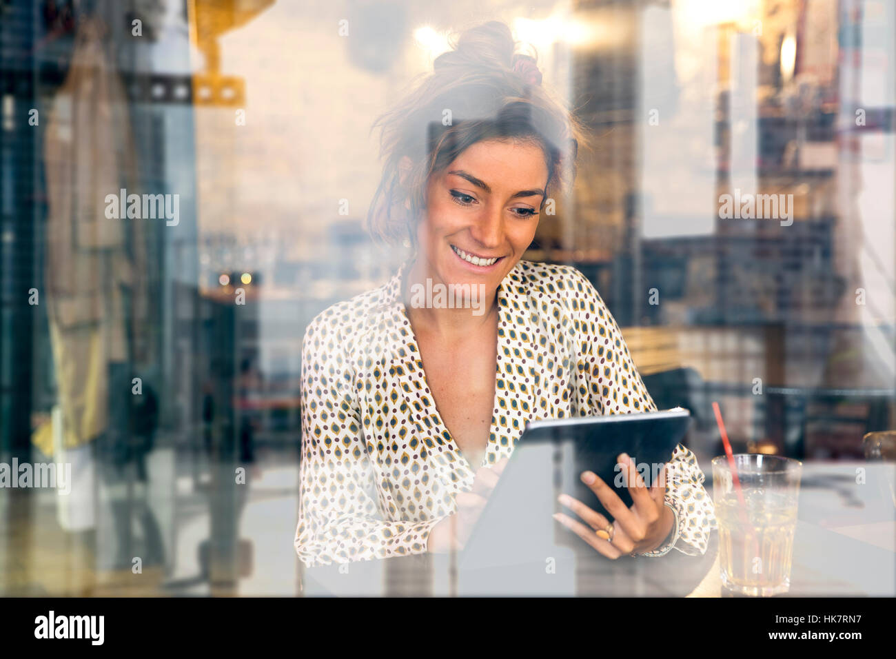 Woman using a Tablet pc in Coffee shop Stock Photo