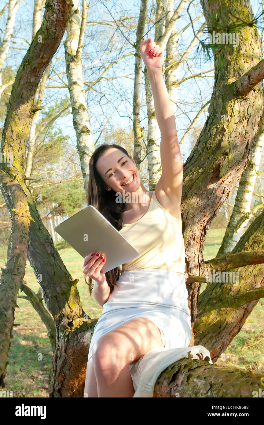 woman, tree, alacrity, enthusiasm, amusement, enjoyment, joy, gag, joke, Stock Photo
