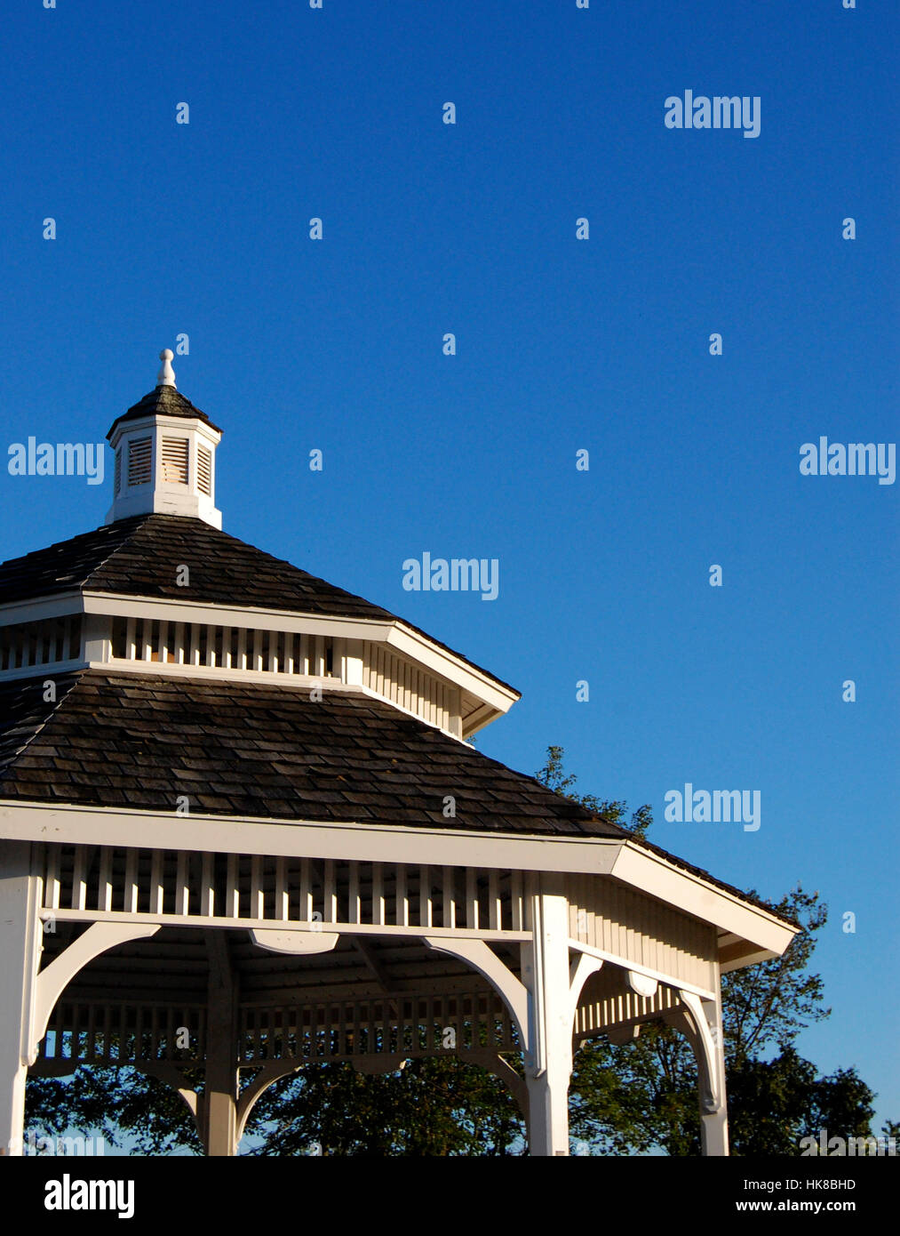 Roof of ornate gazebo with blue sky background Stock Photo - Alamy