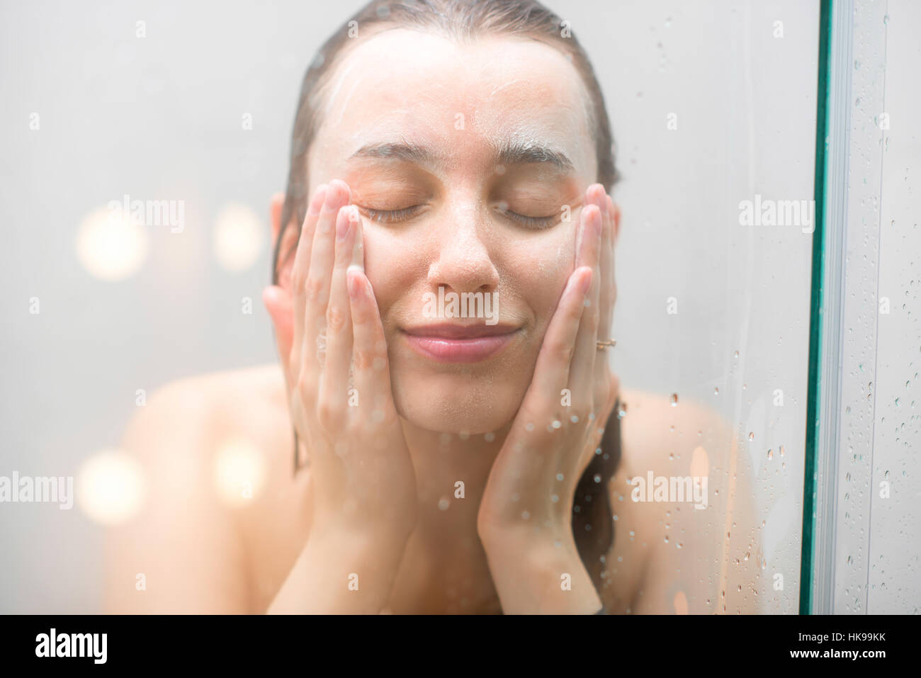 Woman washing face Stock Photo Alamy