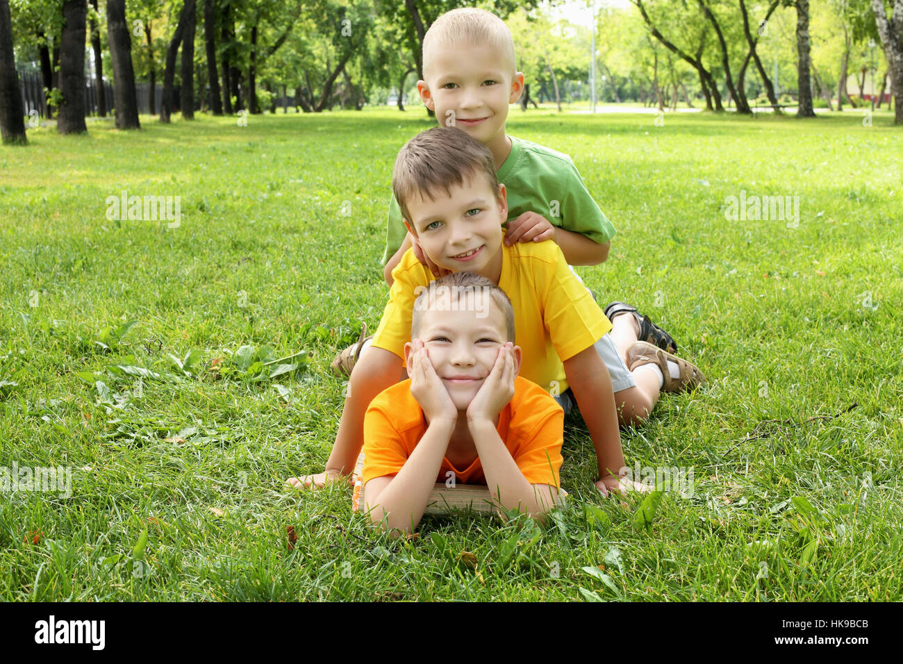 Boy lying on grass hi-res stock photography and images - Alamy