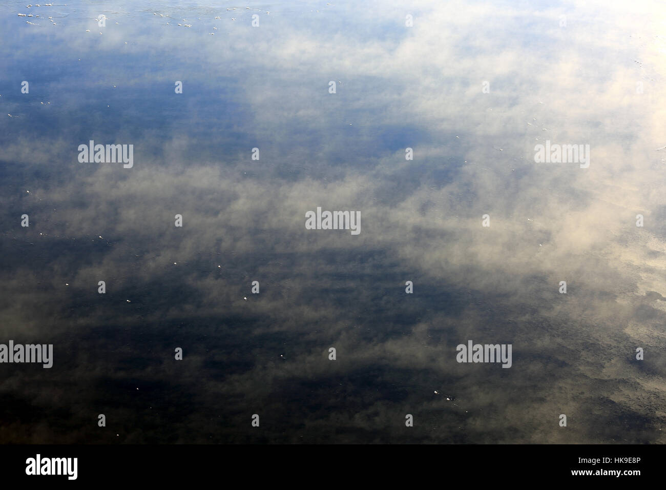 Background of vapor rising from freezing deep blue sea on a very cold ...