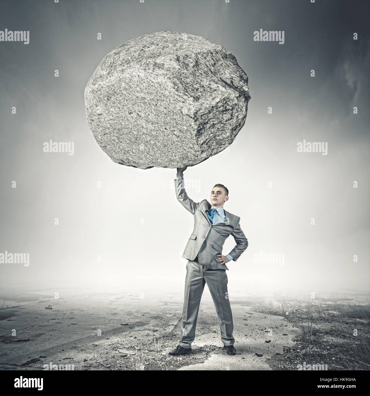 Man holding rock above head hi-res stock photography and images - Alamy