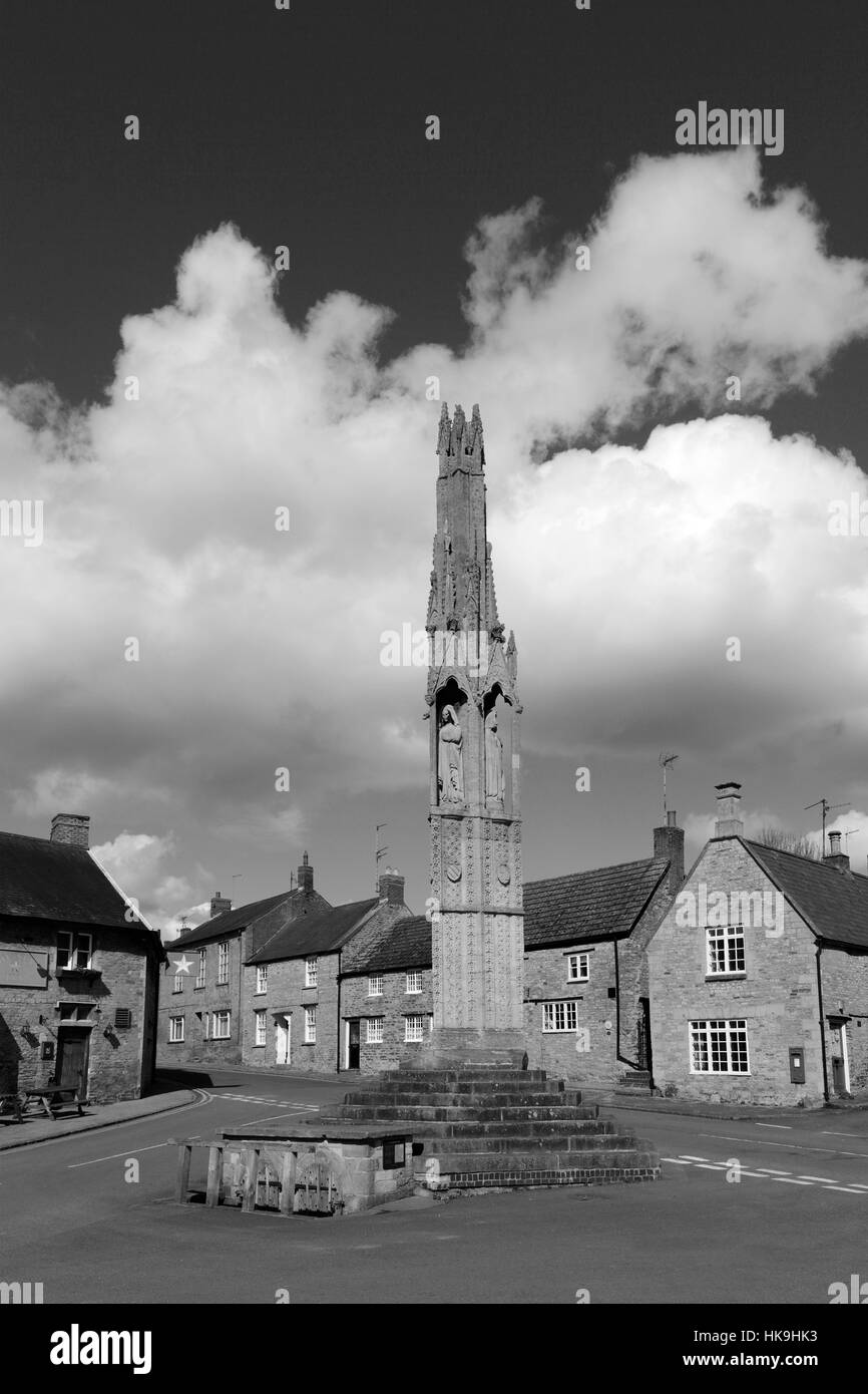 The Queen Eleanor Cross in the village of Geddington, Northamptonshire, England Stock Photo