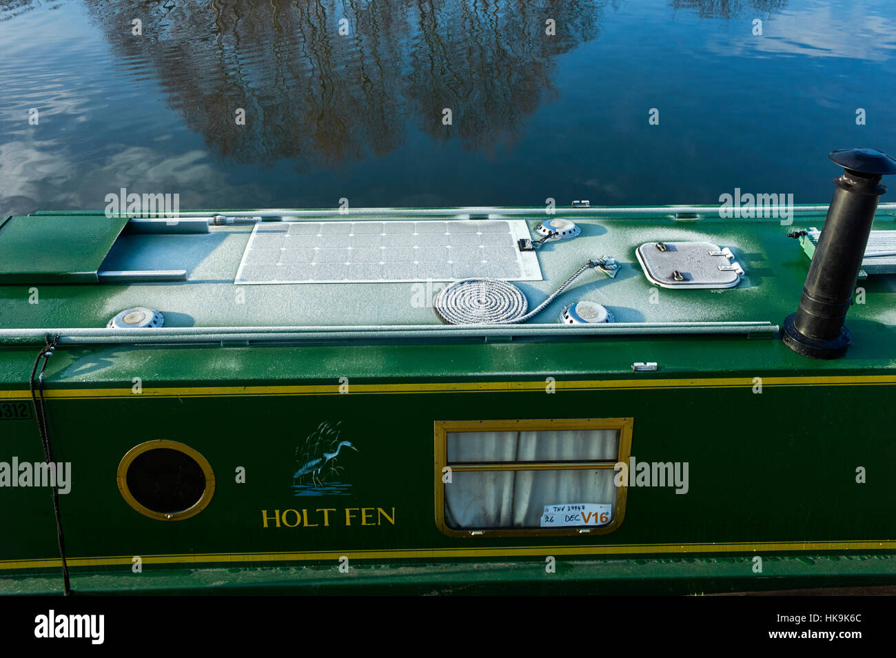 Narrowboat on River Thames at dawn moored up outside Hampton Court Palace Stock Photo