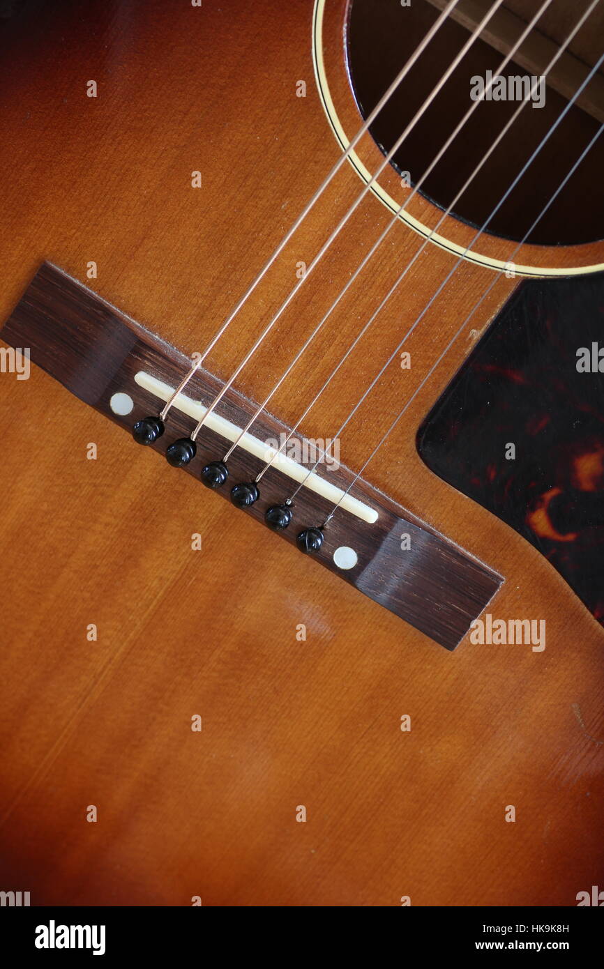 Close up of acoustic guitar strings and bridge Stock Photo Alamy