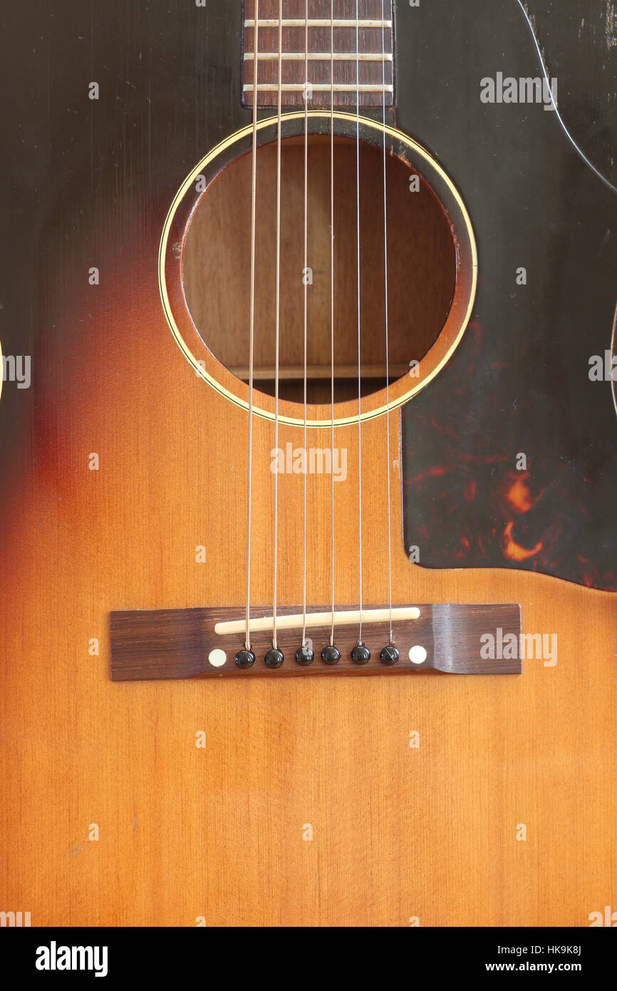 Acoustic guitar with six strings and sound hole Stock Photo Alamy