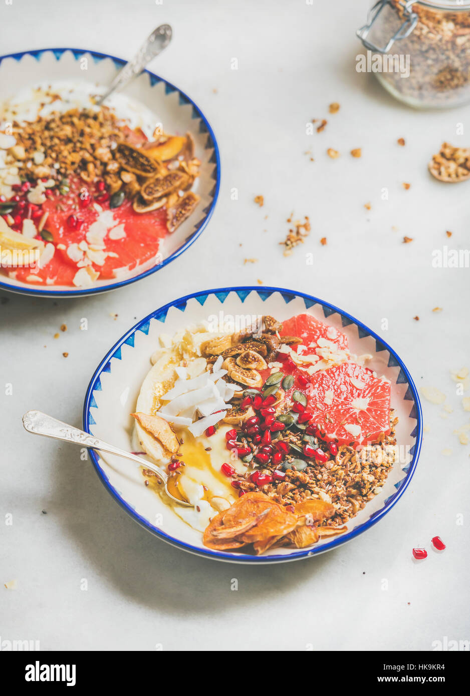 Healthy breakfast yogurt bowls with granola, grapefruit, banana
