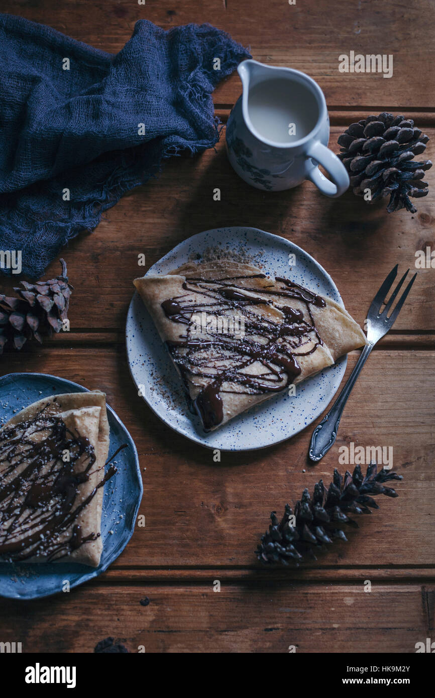 Crepes drizzled with chocolate and ground almonds Stock Photo