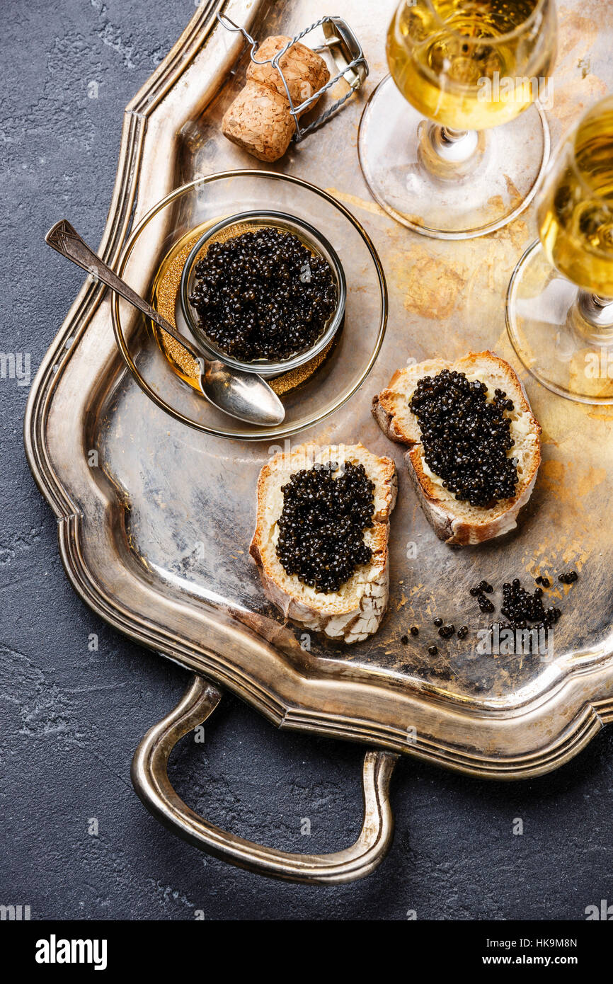 Sturgeon black caviar, sandwiches and champagne on silver tray Stock Photo