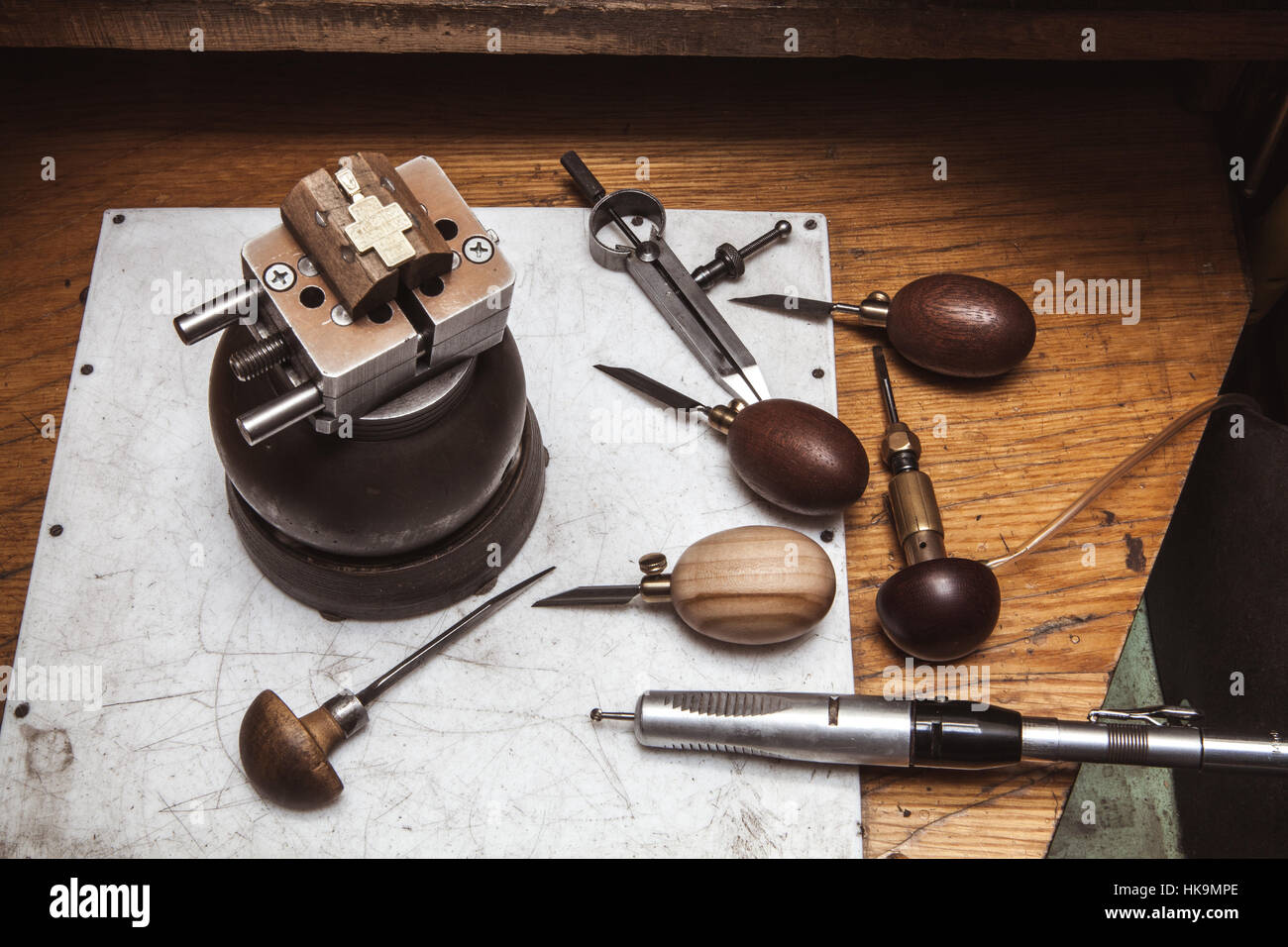 Cross in bullseye vise, gravers, compasses and drilling machine Stock