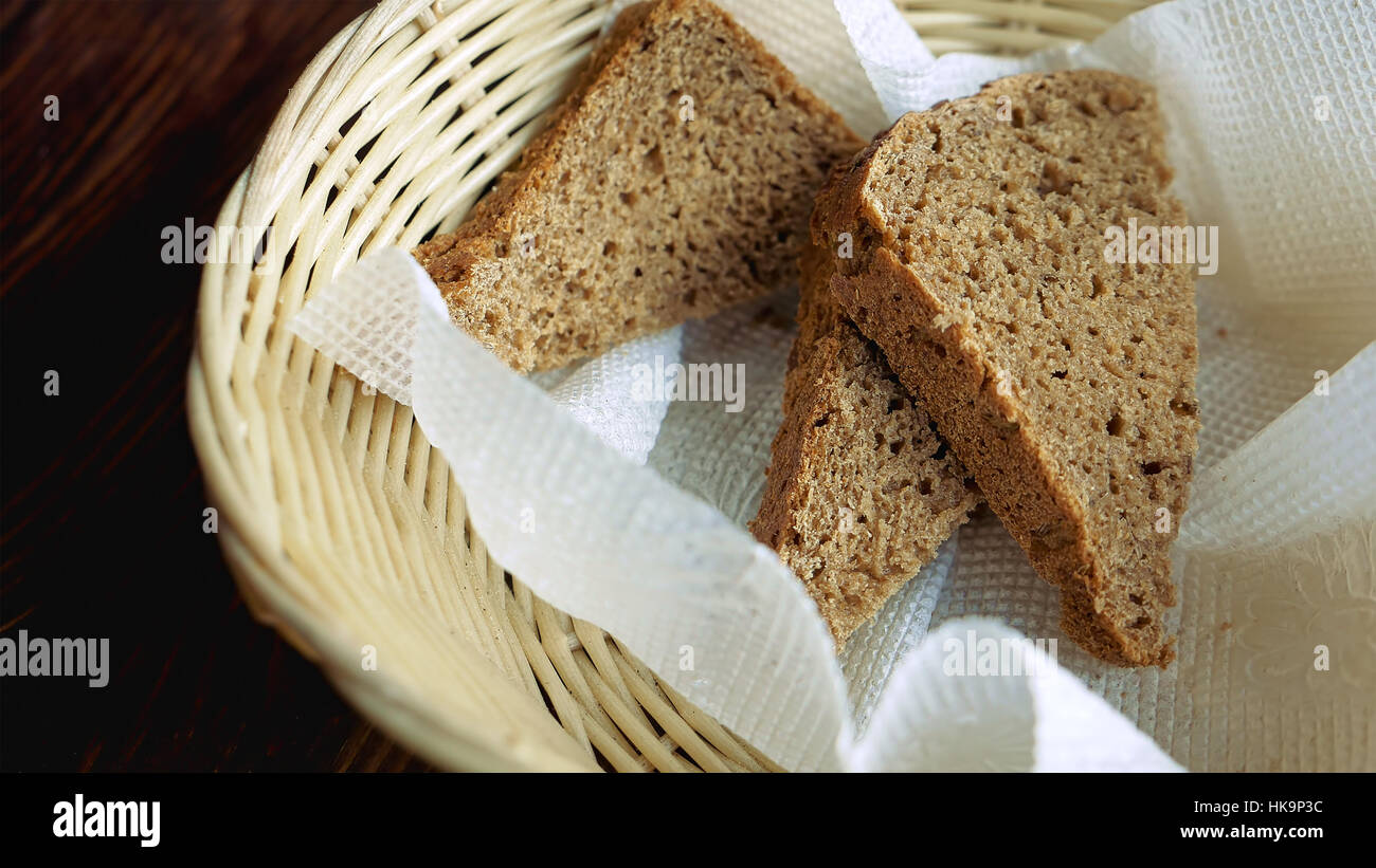 Basket with three pieces of bread Stock Photo Alamy
