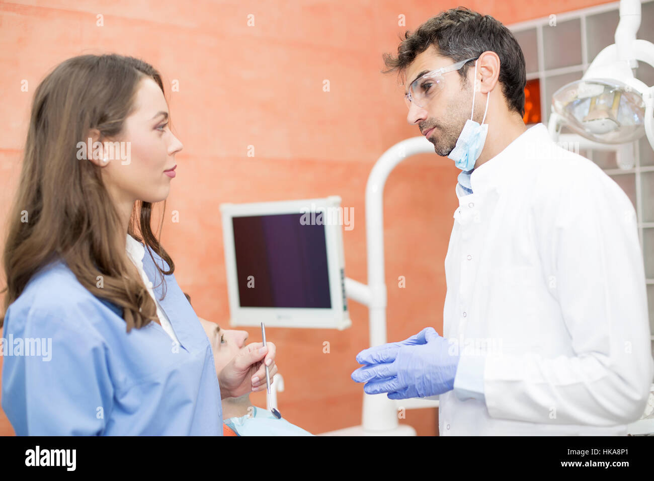 Young male and female doctors posing in the dentist office Stock Photo