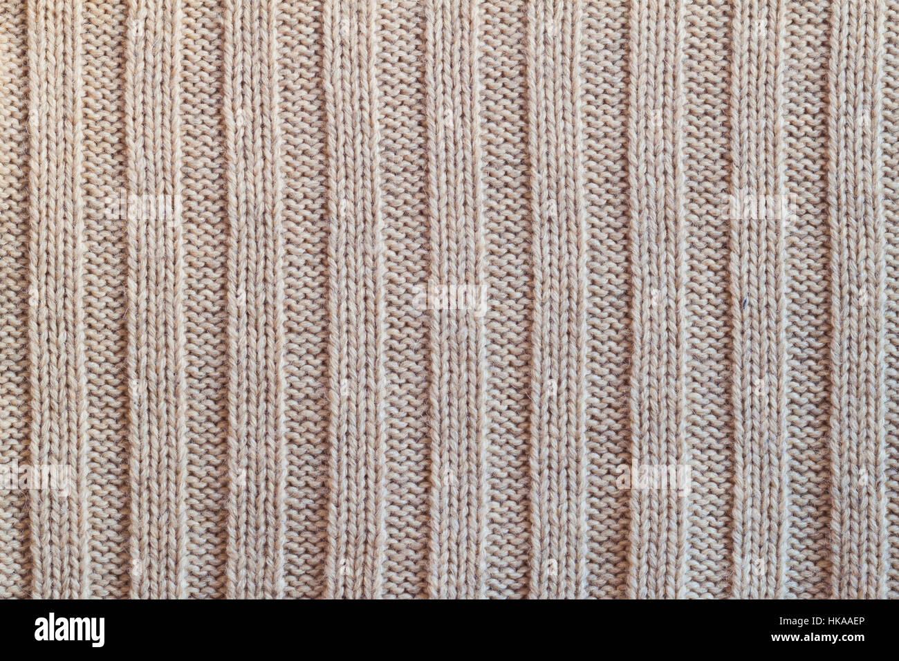 Creamy wool knitted warm clothes for the winter fabric texture