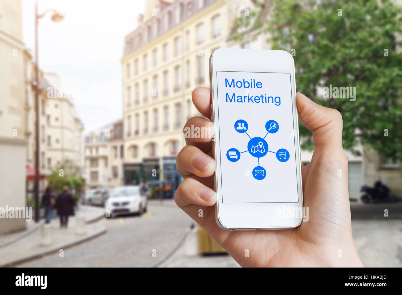 Mobile marketing concept with a woman hand showing a smartphone screen with digital app data Stock Photo