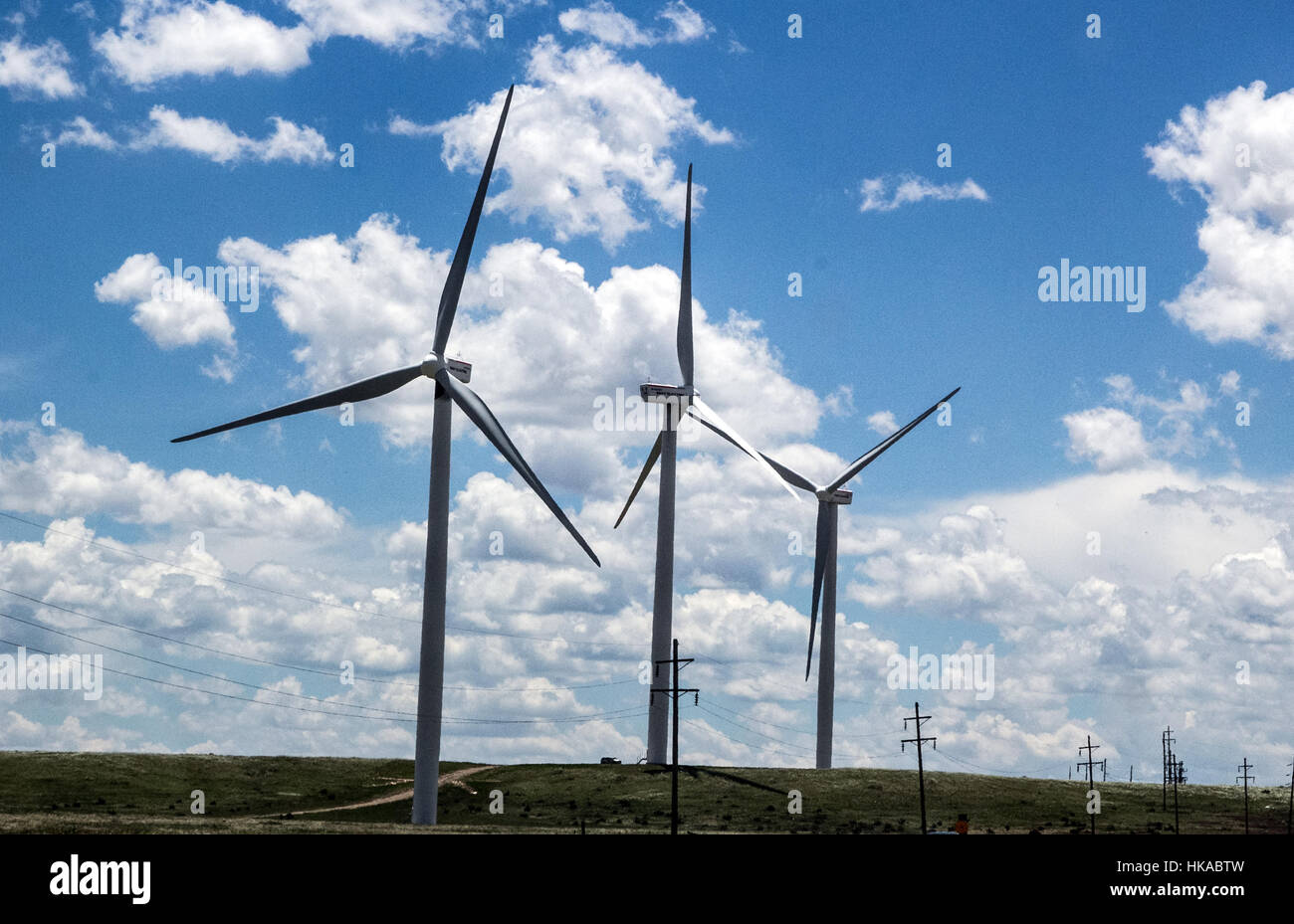 Huge wind turbines line the highways of New Mexico generating wind power. Stock Photo