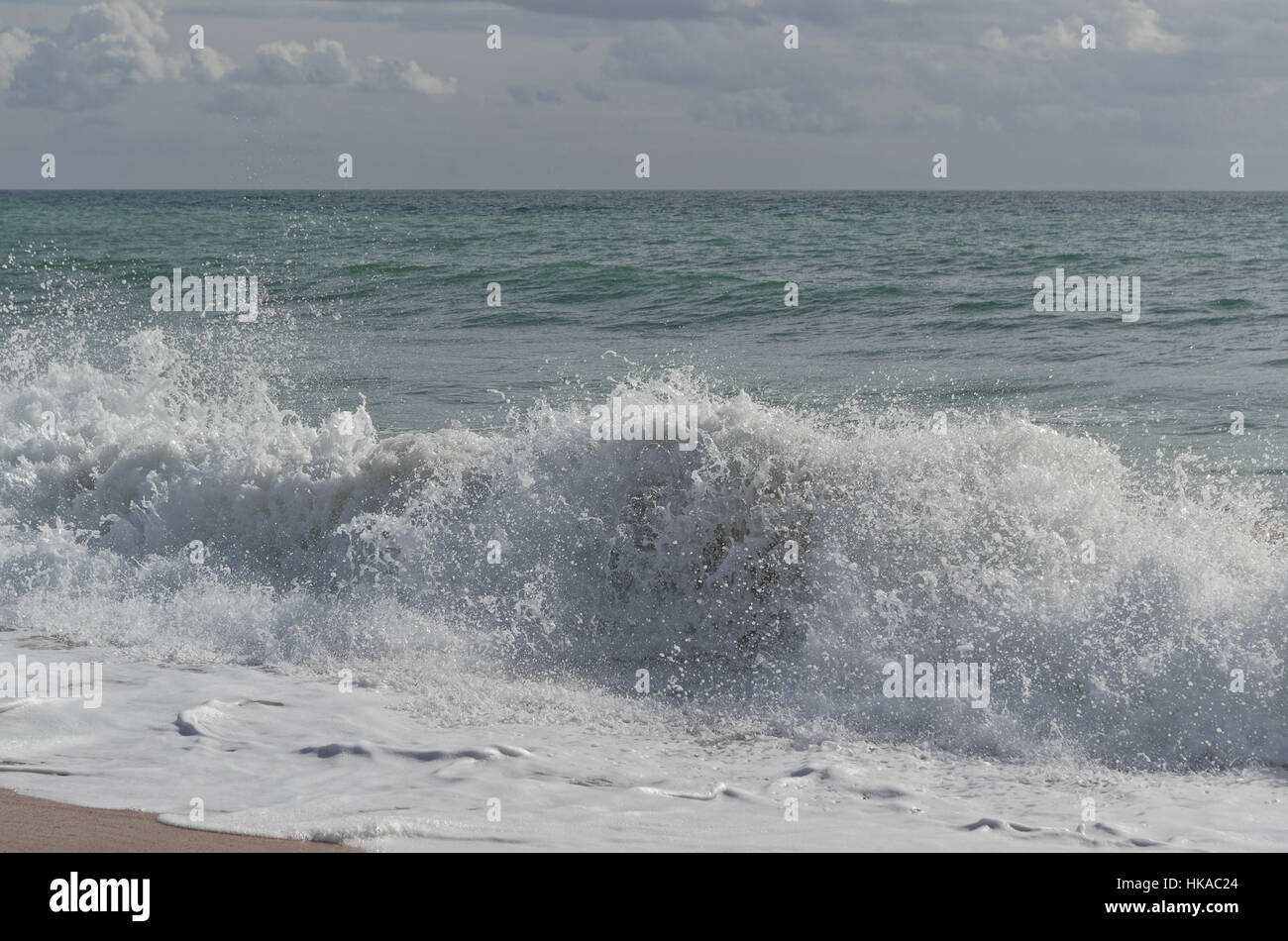 Crashing beach waves in Algarve, Portugal Stock Photo