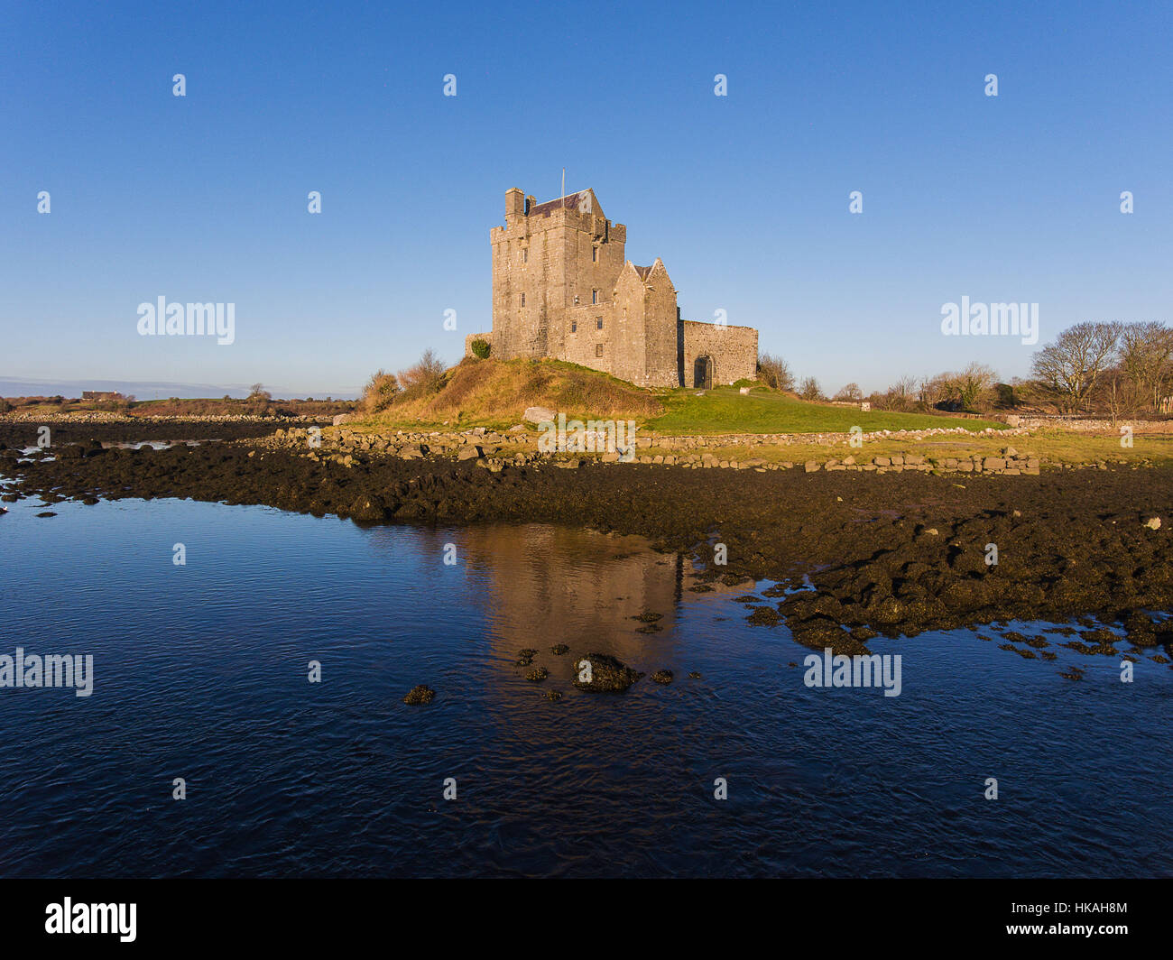 Aerial Dunguaire Castle Evening Sunset, near Kinvarra in County Galway, Ireland - Wild Atlantic Way Route. Famous public tourist attraction in Ireland Stock Photo