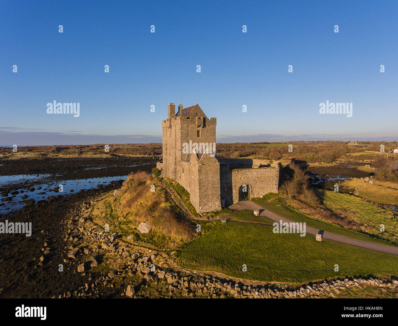 Aerial Dunguaire Castle Evening Sunset, near Kinvarra in County Galway, Ireland - Wild Atlantic Way Route. Famous public tourist attraction in Ireland Stock Photo