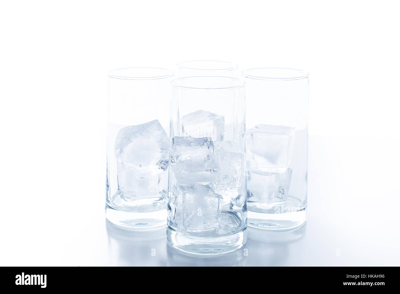 Empty Glasses With Large Ice Cubes On A White Background Stock Photo Empty glasses with large ice cubes on a white background stock photo