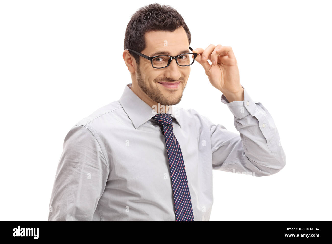 Young businessman smiling and looking at the camera isolated on white ...