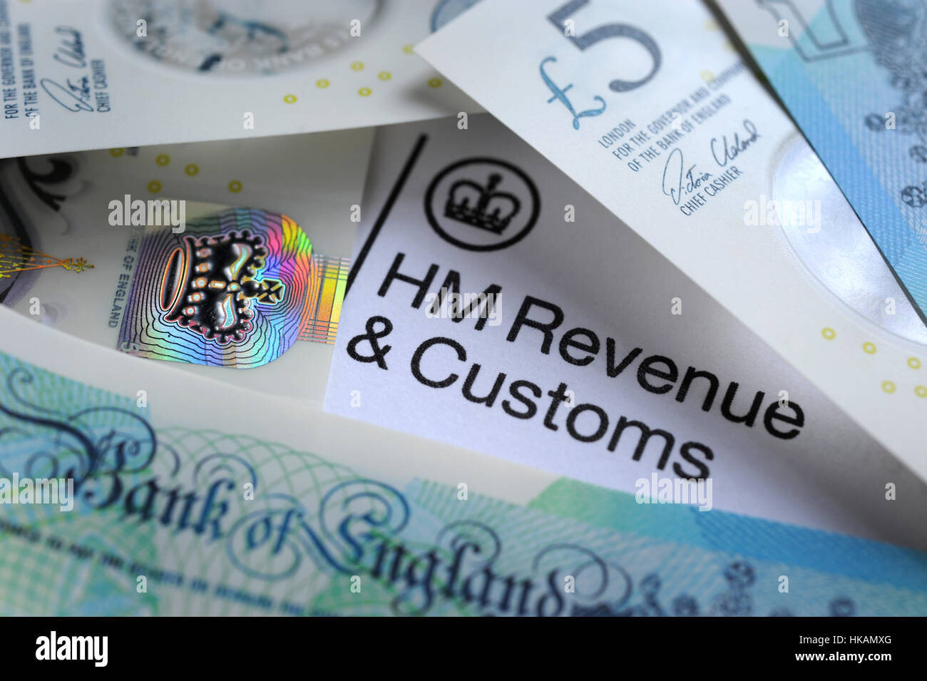 HM REVENUE AND CUSTOMS LETTER HEAD WITH BRITISH MONEY RE HMRC TAX TAXES INCOME WAGES YEAR SELF ASSESSMENT FORM  AVOIDANCE UK Stock Photo