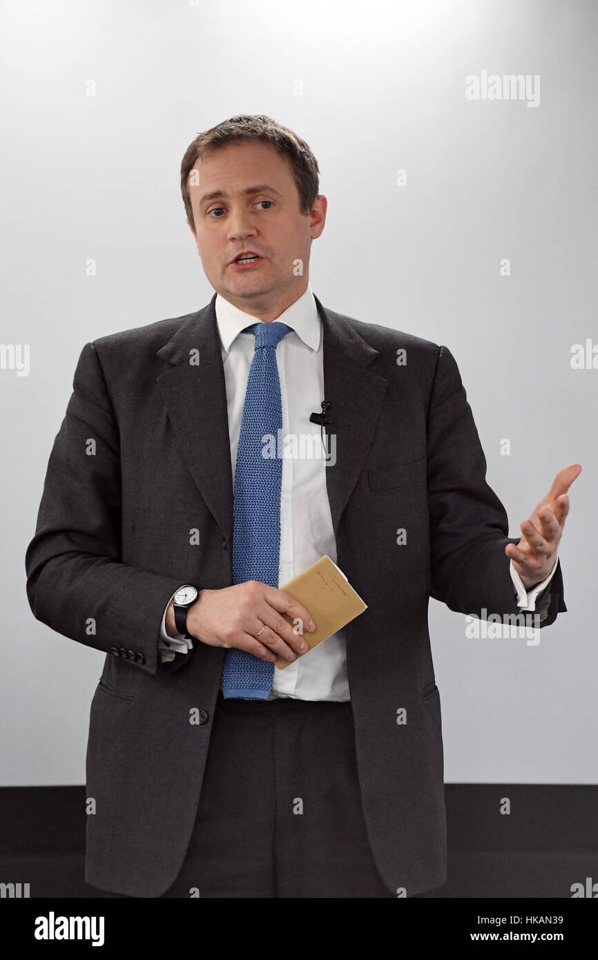 Tom Tugendhat MP speaks at the launch of a new bipartisan report titled The Cost of Doing Nothing, co-authored by the late Jo Cox MP, at the Policy Exchange in Westminster, London. Stock Photo