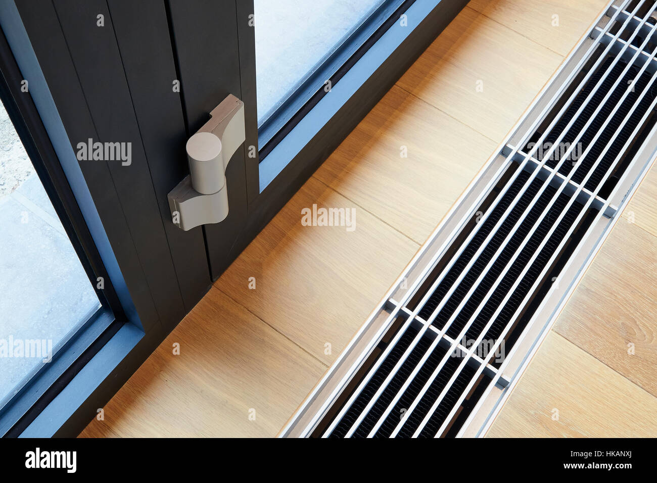Heating grid with ventilation by the floor in hardwood flooring Stock Photo