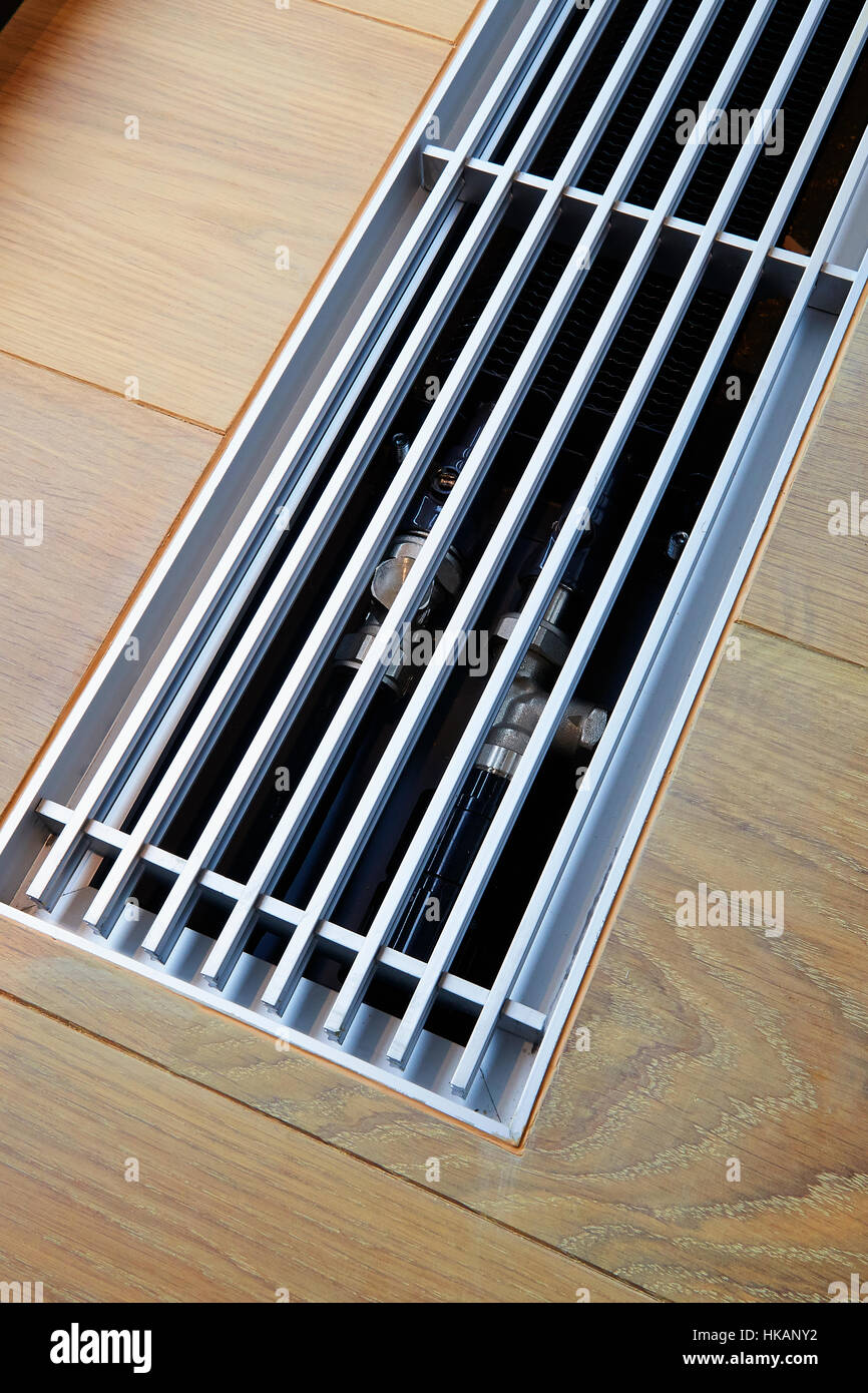 Heating grid with ventilation by the floor in hardwood flooring Stock