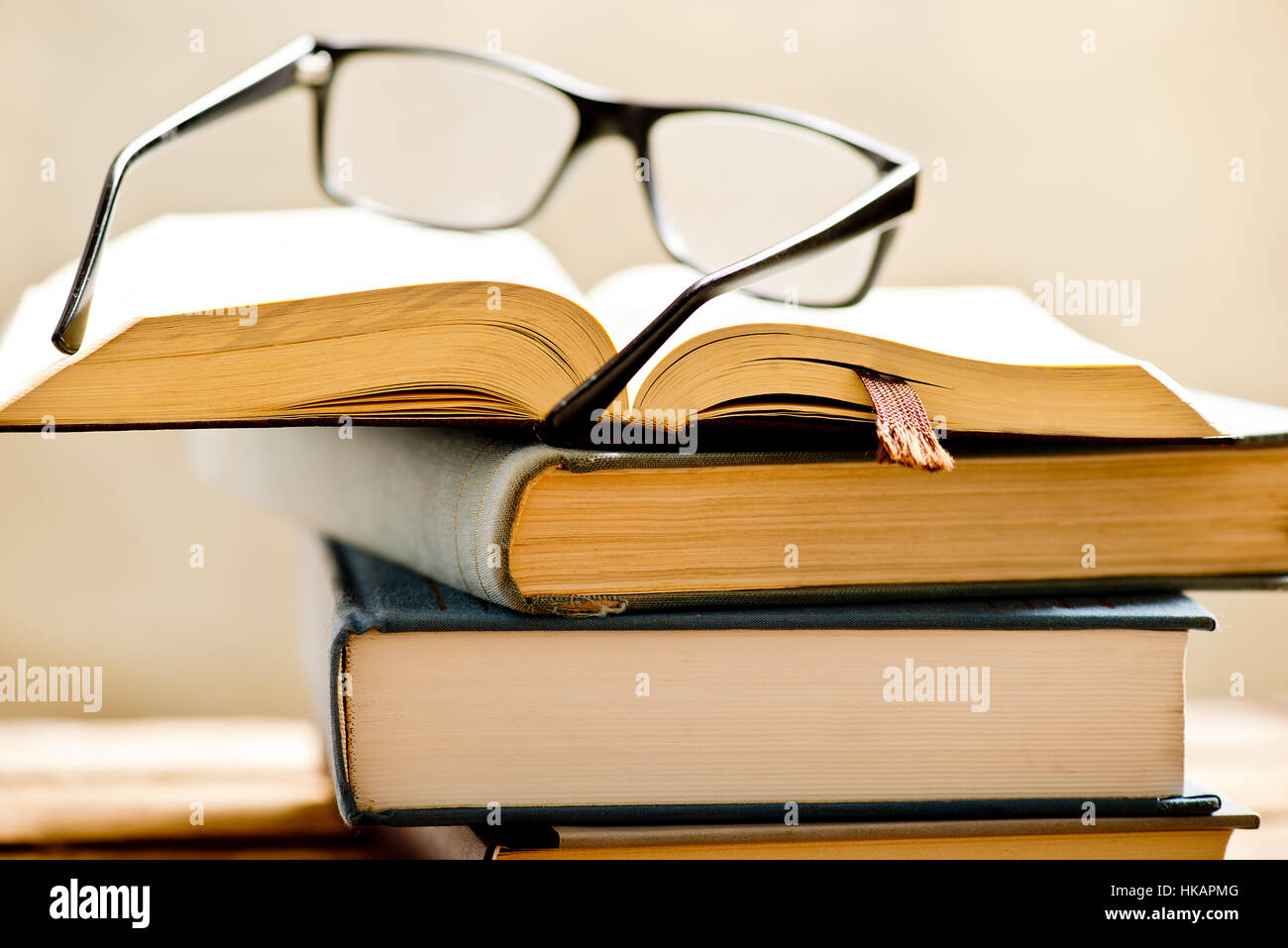 Open Book With Reading Glasses In The Bookshelf Shallow Depth Of