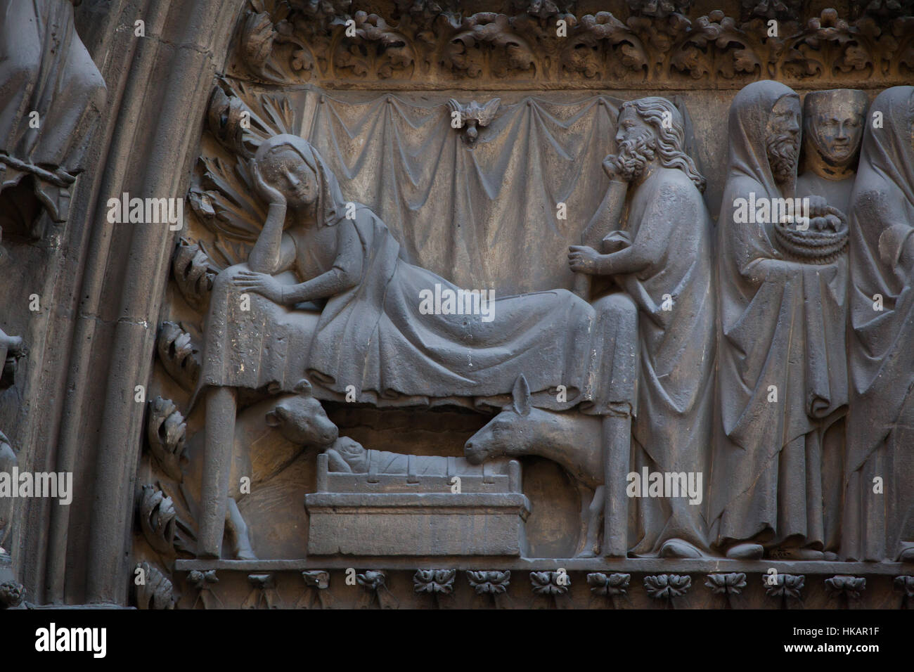 Nativity of Jesus. Detail of the Gothic tympanum from circa 1250 on the northern facade of the Notre-Dame Cathedral (Notre-Dame de Paris) in Paris, France. Stock Photo