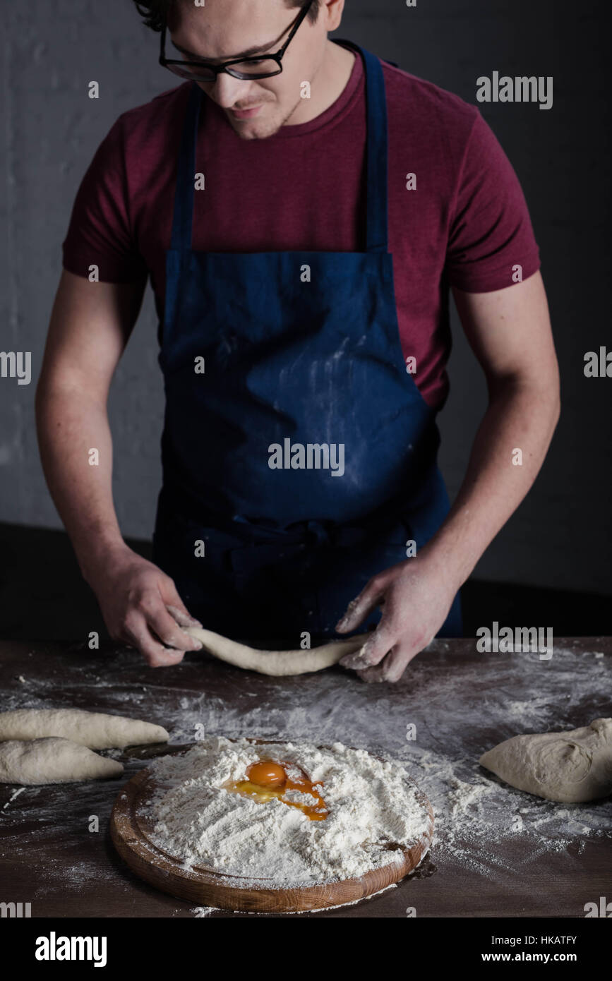 Baker kneading dough Stock Photo Alamy