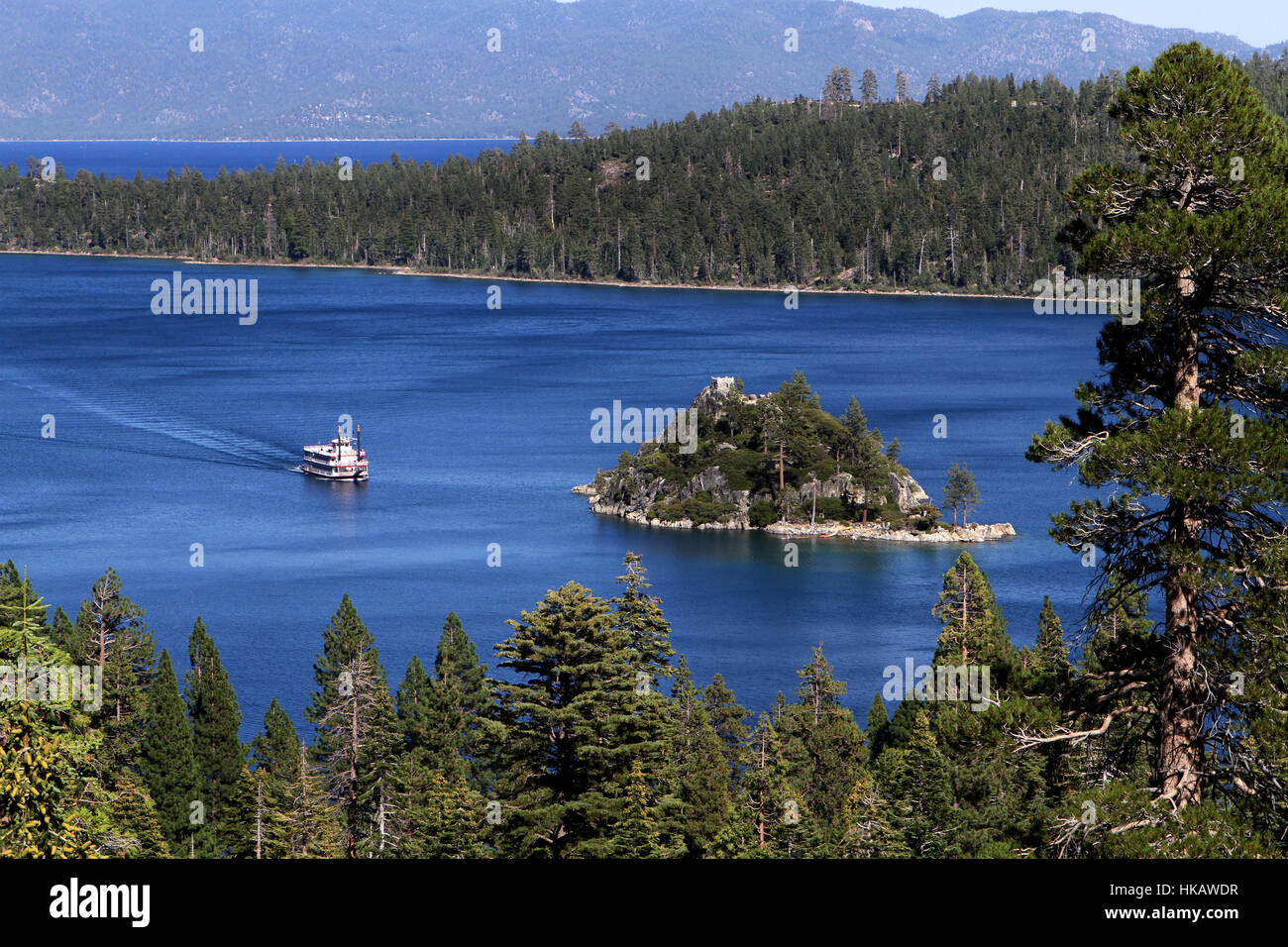 Paddle boat cruises toward Fannette Island on Lake Tahoe in California, USA. Stock Photo