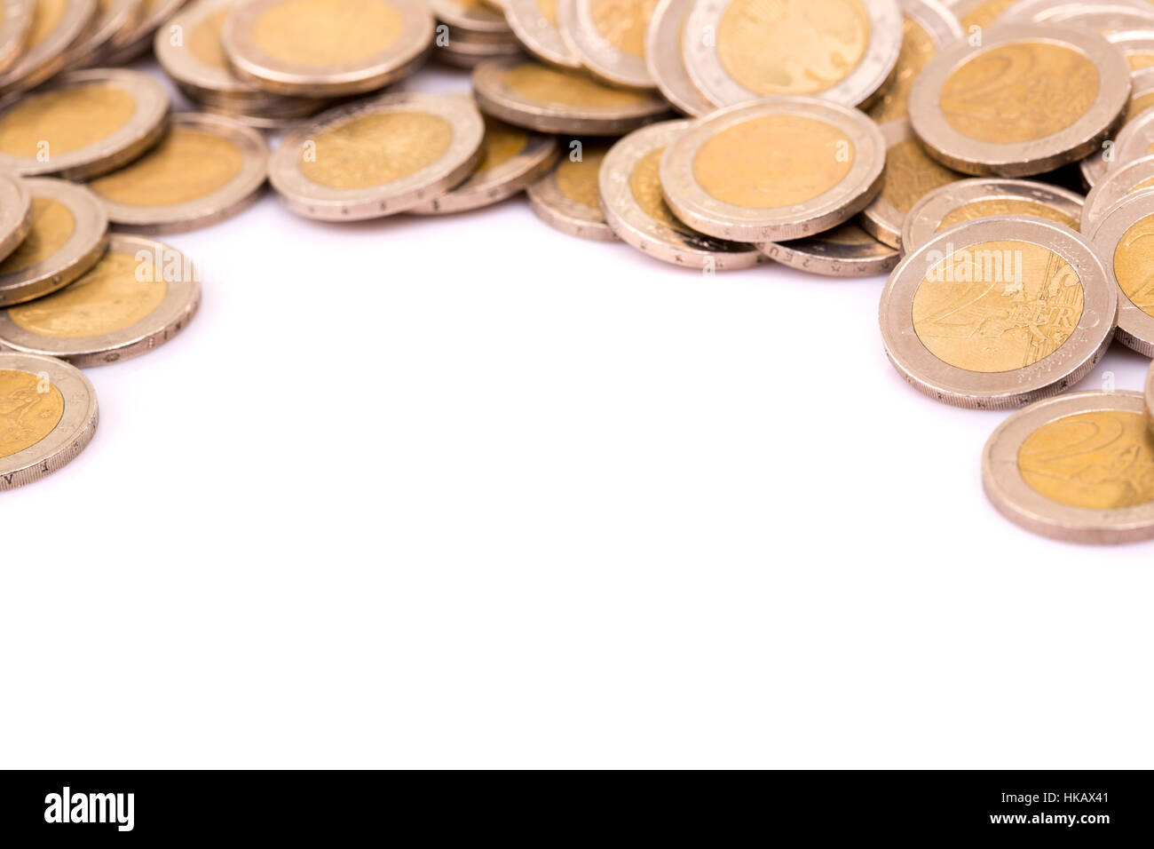 Heap of two euro coins isolated on white background Stock Photo - Alamy