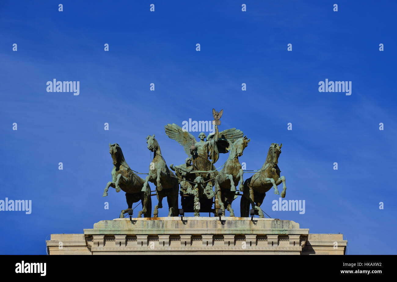 Goddess of Justice bronze quadriga at the top of old Palace of Justice in Rome, with blue sky and copy space Stock Photo