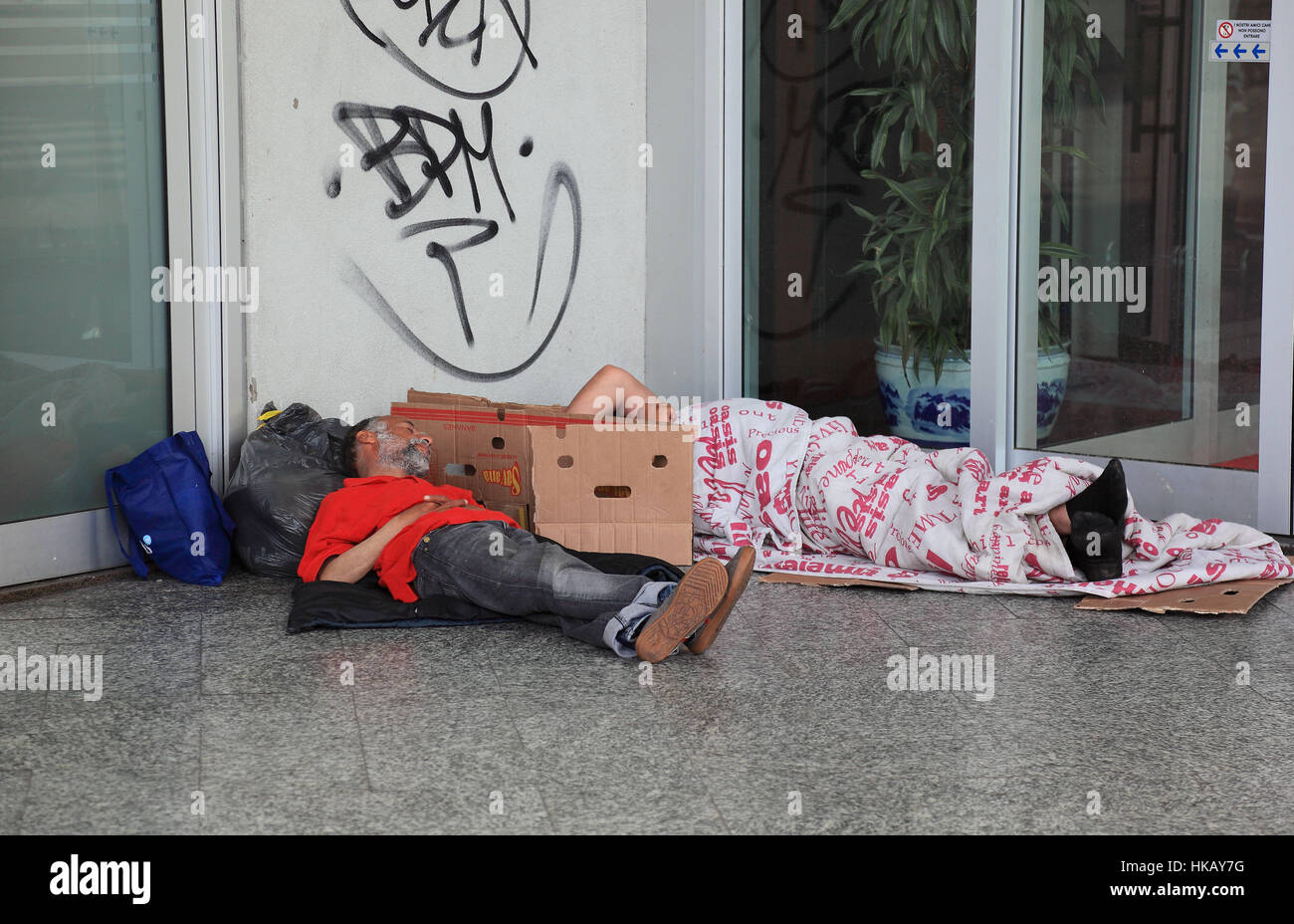 Italy, city Milan, bum, homeless sleeping on the floor Stock Photo