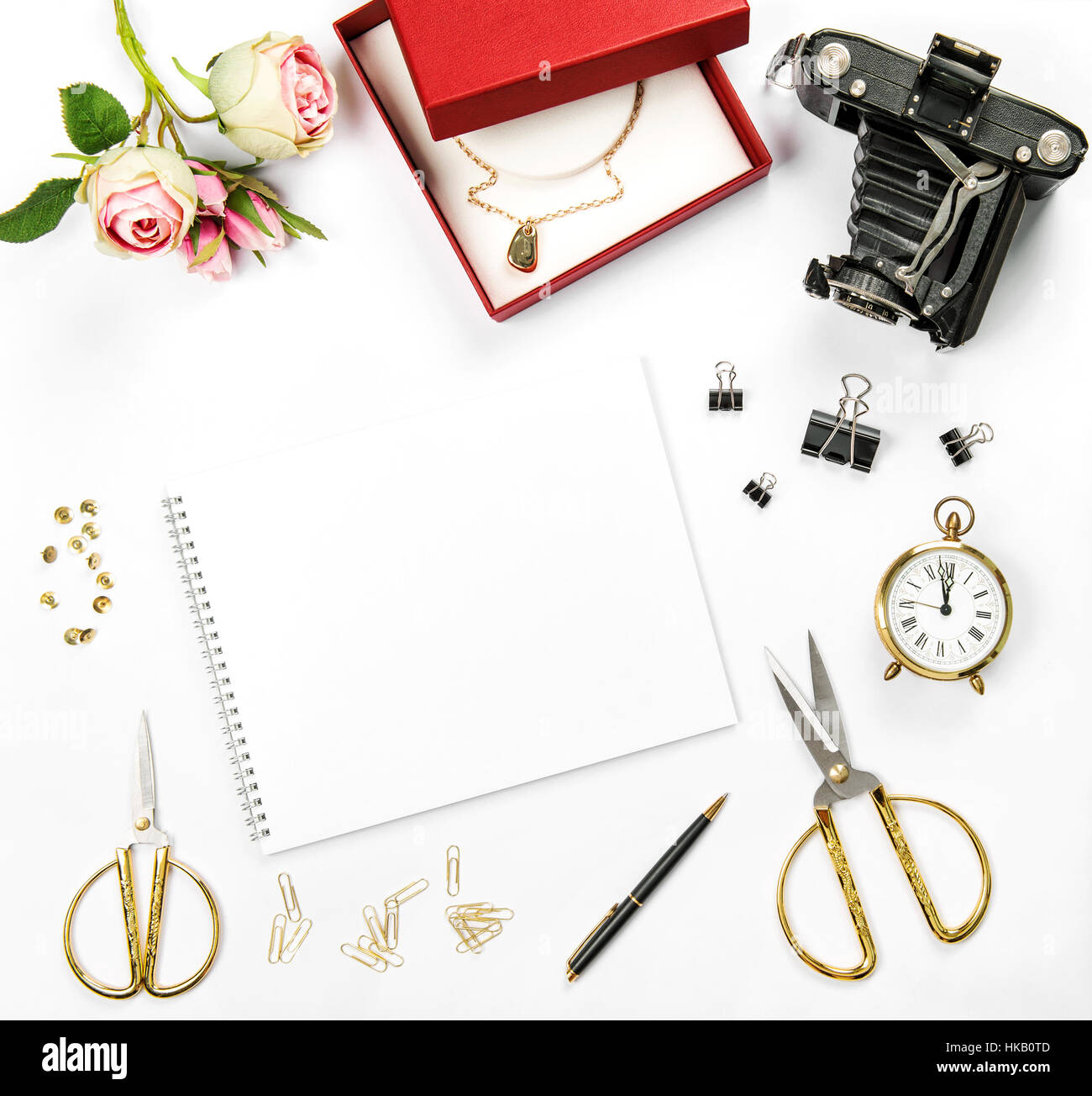 Holidays flat lay background with gift box, vintage camera and rose flowers Stock Photo