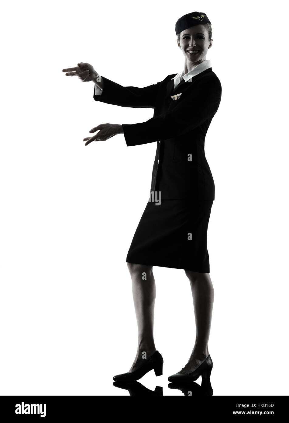 one caucasian Stewardess cabin crew  woman pointing showing isolated on white background in  silhouette Stock Photo