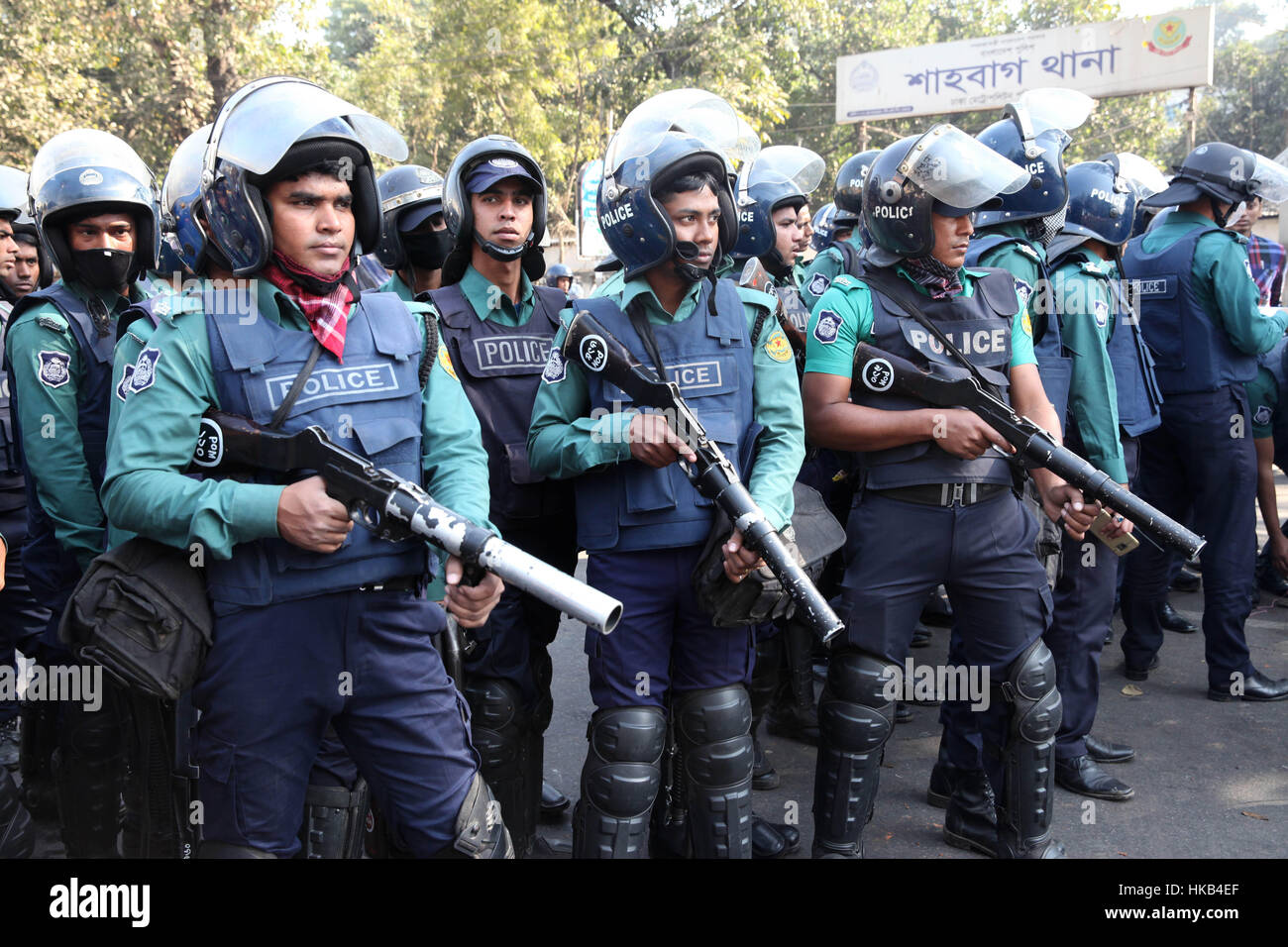 Dhaka, Bangladesh. 26th Jan, 2017. Bangladeshi police ready to fired tear gas to disperse activists during a strike to protest the construction of a coal-fired power plant. Clashes erupte as police fired tear gas at hundreds of campaigners protesting against a massive coal-fired power plant they say will destroy the world's largest mangrove forest. Witnesses said Shahbagh Square, Dhaka's main protest venue, turned into a battleground as police used water cannon and fired tear gas and rubber bullets at hundreds of left-wing and environmental protesters. © Monirul Alam (Credit Image: © Moni Stock Photo