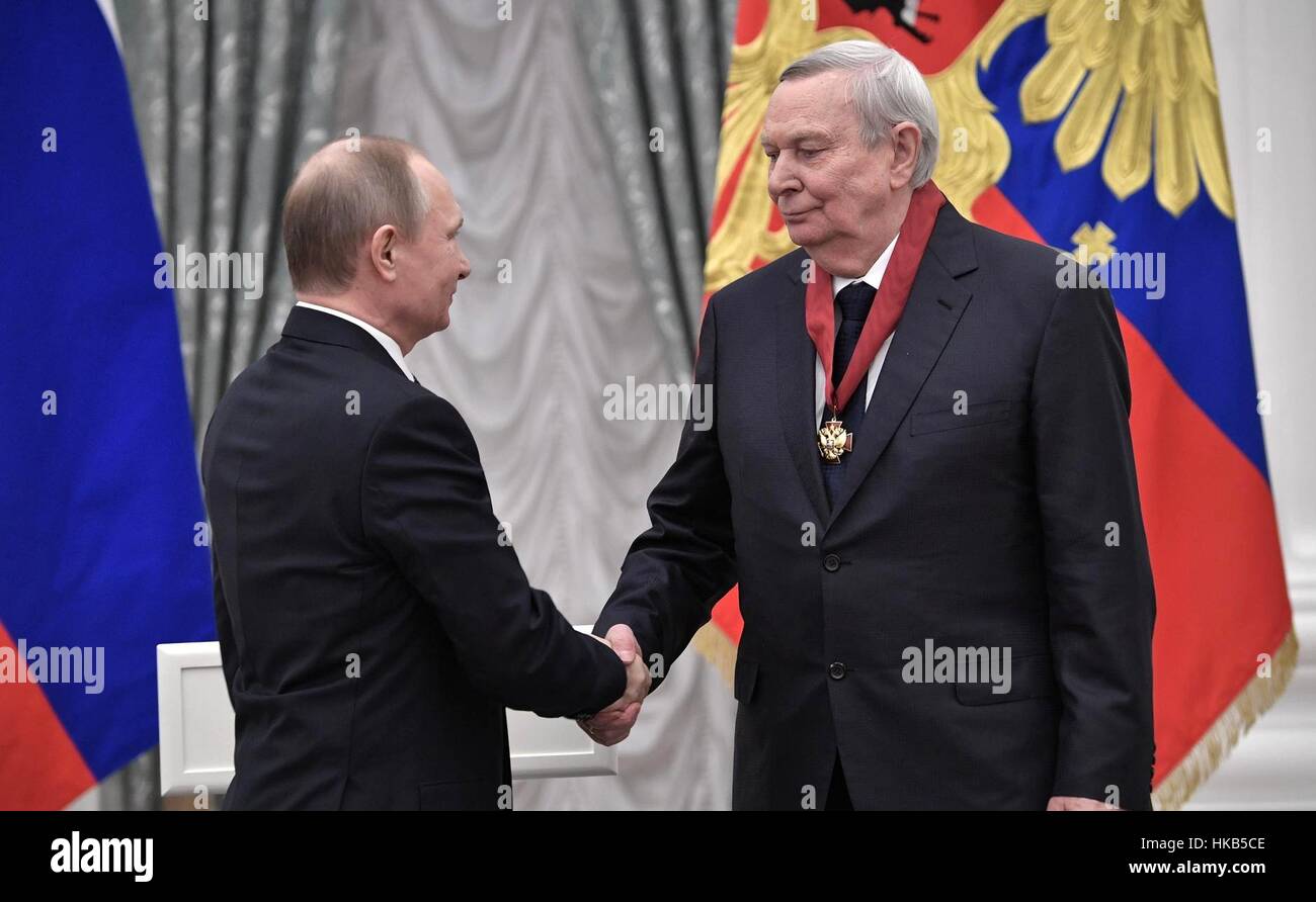 Moscow, Russia. 26th Jan, 2017. Russian President Vladimir Putin presents Alexander Baranov, academician in the Russian Academy of Sciences and director of the Scientific Centre of Children's Health, with the the Order for Services to the Fatherland during a ceremony at the Kremlin in Moscow, Russia. Credit: Planetpix/Alamy Live News Stock Photo