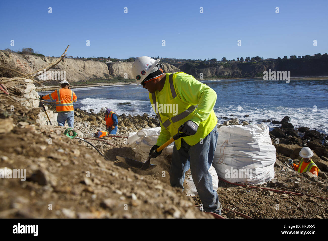 Palos Verdes Estates, CA, USA. 29th Nov, 2016. City contractors demolish a patio fort built by local surfers on the shoreline of the Pacific Ocean at Lunada Bay on Tuesday, November 29, 2016 in Palos Verdes Estates, Calif. The patio fort was a popular hangout of the Lunada Bay Boys and the process of tearing it down has become a flashpoint in the debate over surfing localism. © 2016 Patrick T. Fallon Credit: Patrick Fallon/ZUMA Wire/Alamy Live News Stock Photo
