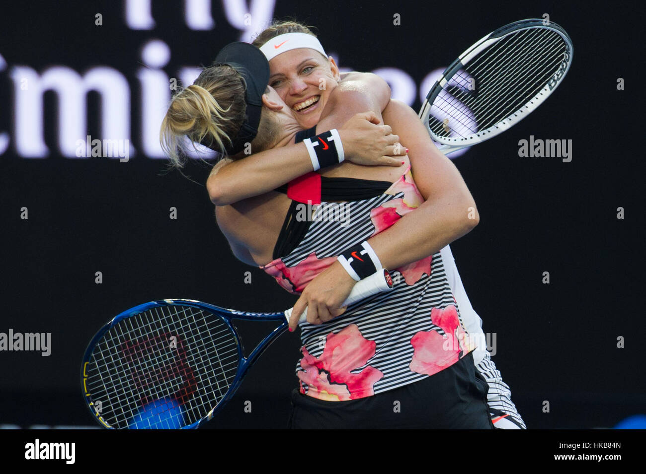 Melbourne, Australia. 27th Jan, 2017. Bethanie Mattek-Sands (front) of the U.S. and Lucie Safarova of the Czech Republic celebrate after winning the women's doubles final against Andrea Hlavackova of the Czech Republic and Peng Shuai of China at the Australian Open tennis championships in Melbourne, Australia, Jan. 27, 2017. Bethanie Mattek-Sands of the U.S. and Lucie Safarova of the Czech Republic won 2-1. Credit: Bai Xue/Xinhua/Alamy Live News Stock Photo